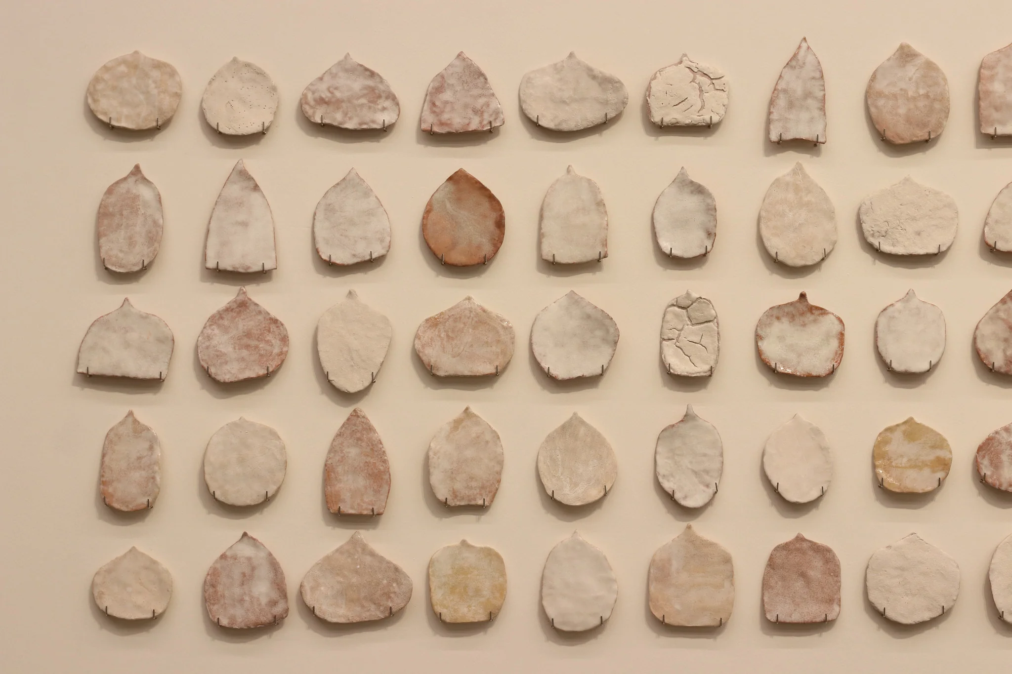 Pinaree Sanpitak, Precariously Sacred, 2000-2002. Glazed terracotta
, dimensions variable. Photo: Aroon Peampoonsopon . Courtesy of the Jim Thompson Art Center and the James H.W. Thompson Foundation © Jim Thompson Art Center