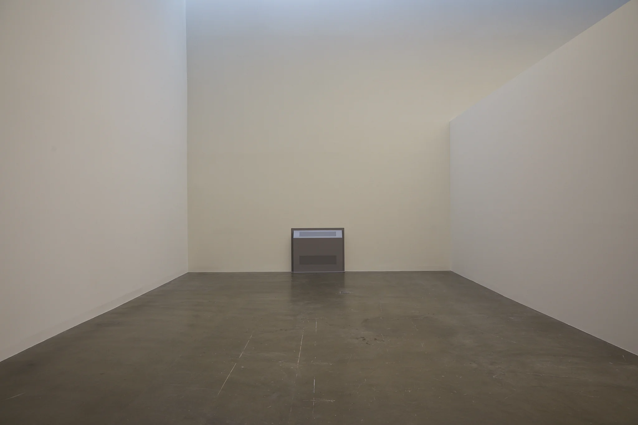 Sung Tieu,, Protective Cover, (Headache), 2022. ound installation, polyester powder coated steel wall mounted cover, tamper resistant screws, speaker, 90 x 110 x 20 cm 35 3/8 x 43 1/4 x 7 7/8 inches sound: continuous loop. . Photo: Thakueng Withusuwan. Courtesy of the Jim Thompson Art Center and the James H.W. Thompson Foundation © Jim Thompson Art Center