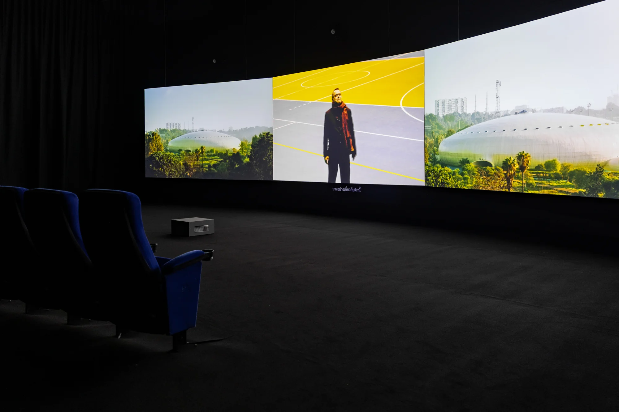 Naeem Mohaiemen, Two Meetings and a Funeral, 2017. Three-channel video, color, sound, 90 mins. Photo: BACC. Courtesy of BACC © BACC