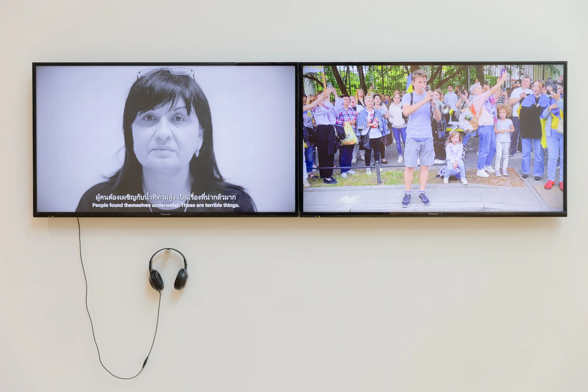 Rafal Milach & Sputnik  Photo Collective, UATLAS. War Migration Record, 2022-2023. Single-channel Video, 10:54 min and Rafal Milach & Sputnik  Photo Collective, Solidarity with Ukraine and anti-war protests in Warsaw, Poland, 2022-2023. Single-channel video, 2:49 min. Courtesy of Rafal Milach and Archive of Public Protests. Photo: BACC. Courtesy of Rafal Milach and Kateryna AleksienkoPhoto: . Courtesy of BACC © BACC